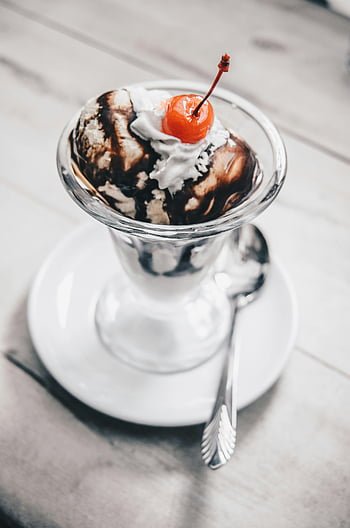 J P ice cream — classic ice cream sundae with whipped cream and cherry